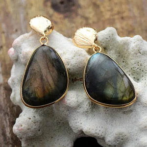 Handcrafted Labradorite drop earrings featuring unique blends of green, grey, and brown tones in each stone. 