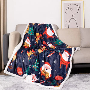 A luxurious Christmas-themed throw blanket featuring flannel on one side and soft white fleece on the other.