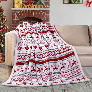 A luxurious Christmas-themed throw blanket featuring flannel on one side and soft white fleece on the other.