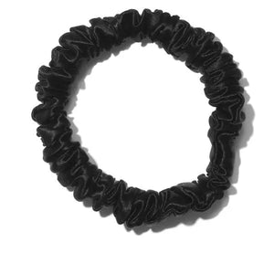 Charcoal black skinny scrunchie made from 100% luxury mulberry silk. Offers low friction pull, gently holding your hair.